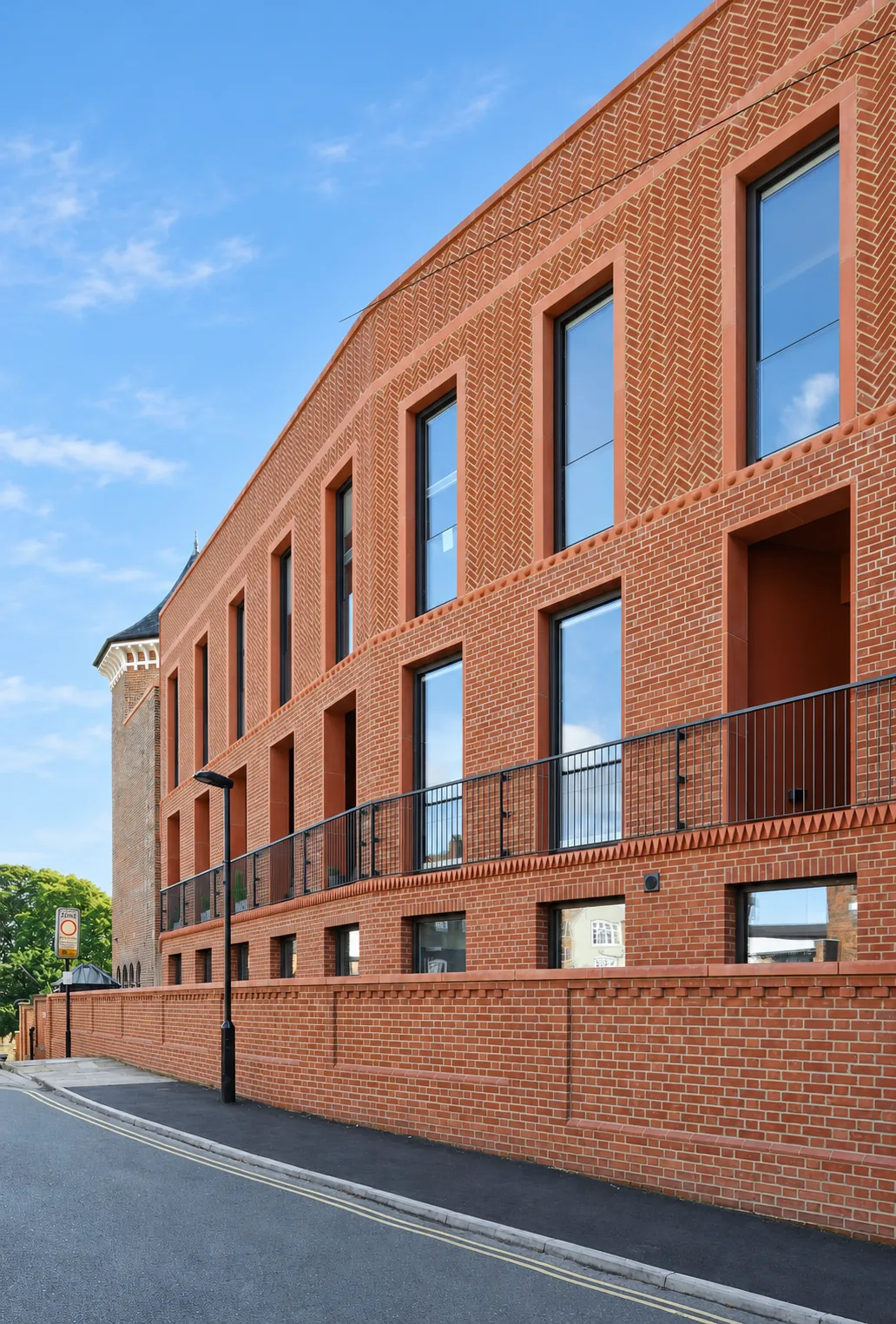 Bailgate Court &mdash; herringbone brickwork and deep window reveals on the new terrace