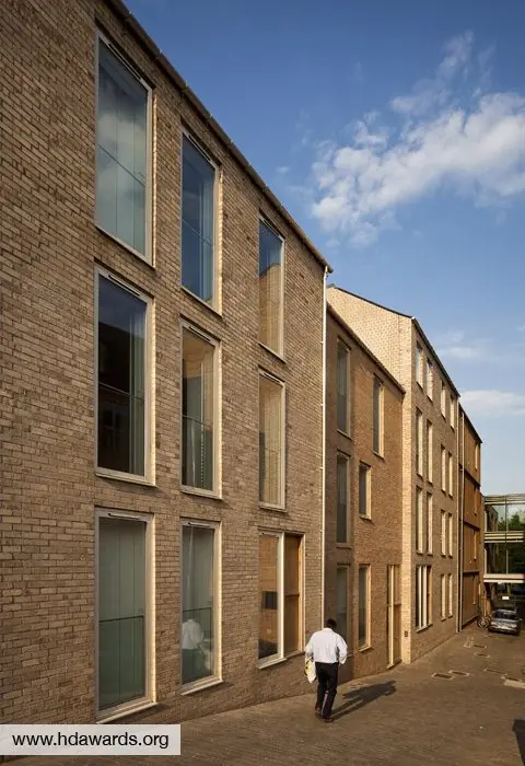 Museum Court &mdash; pale brick elevation in sunlight